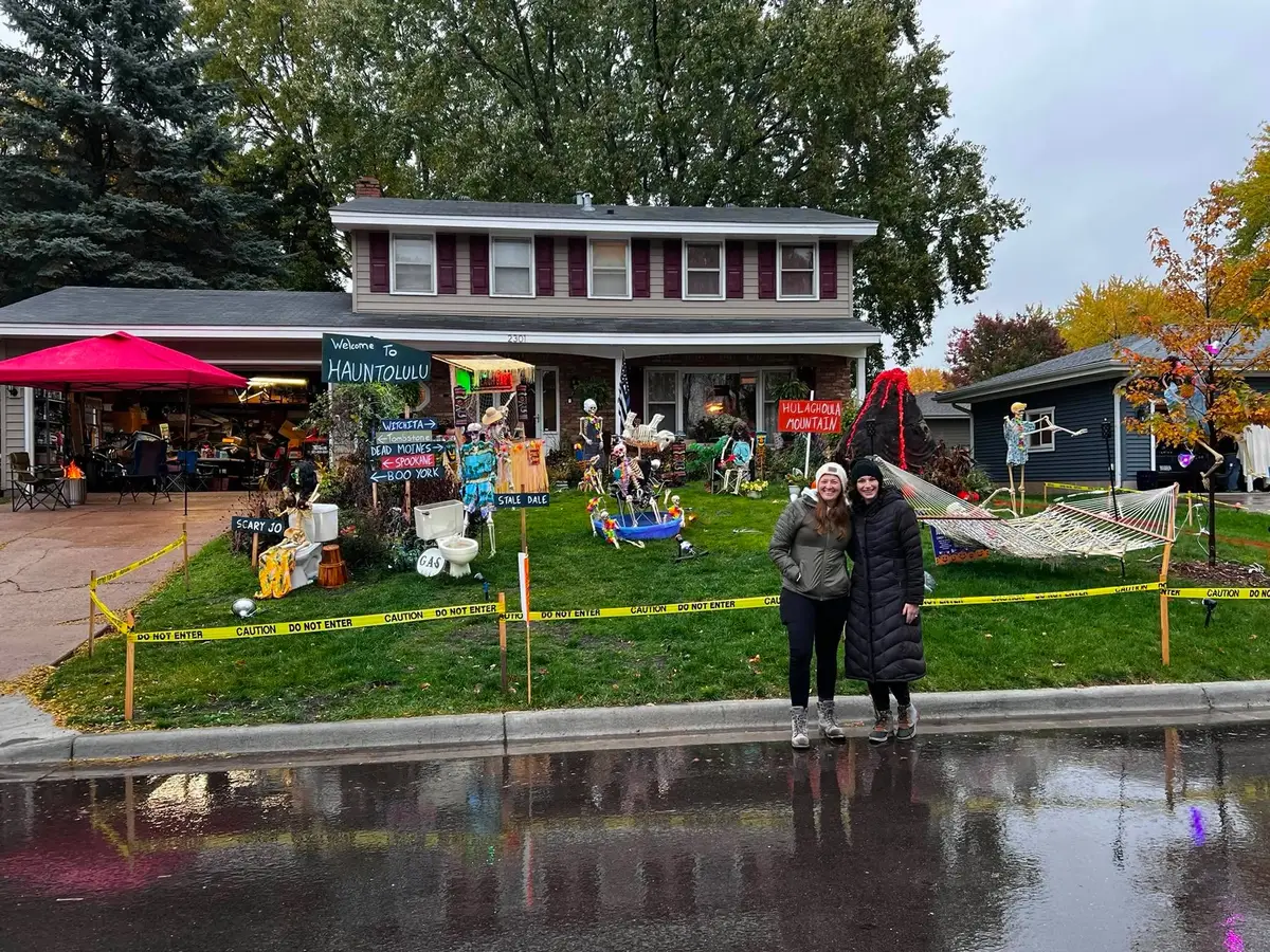 A block of neighbors gathered in a decorated yard